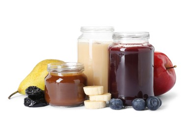 Photo of Jars with healthy baby food, blueberries, prunes and fresh fruits isolated on white