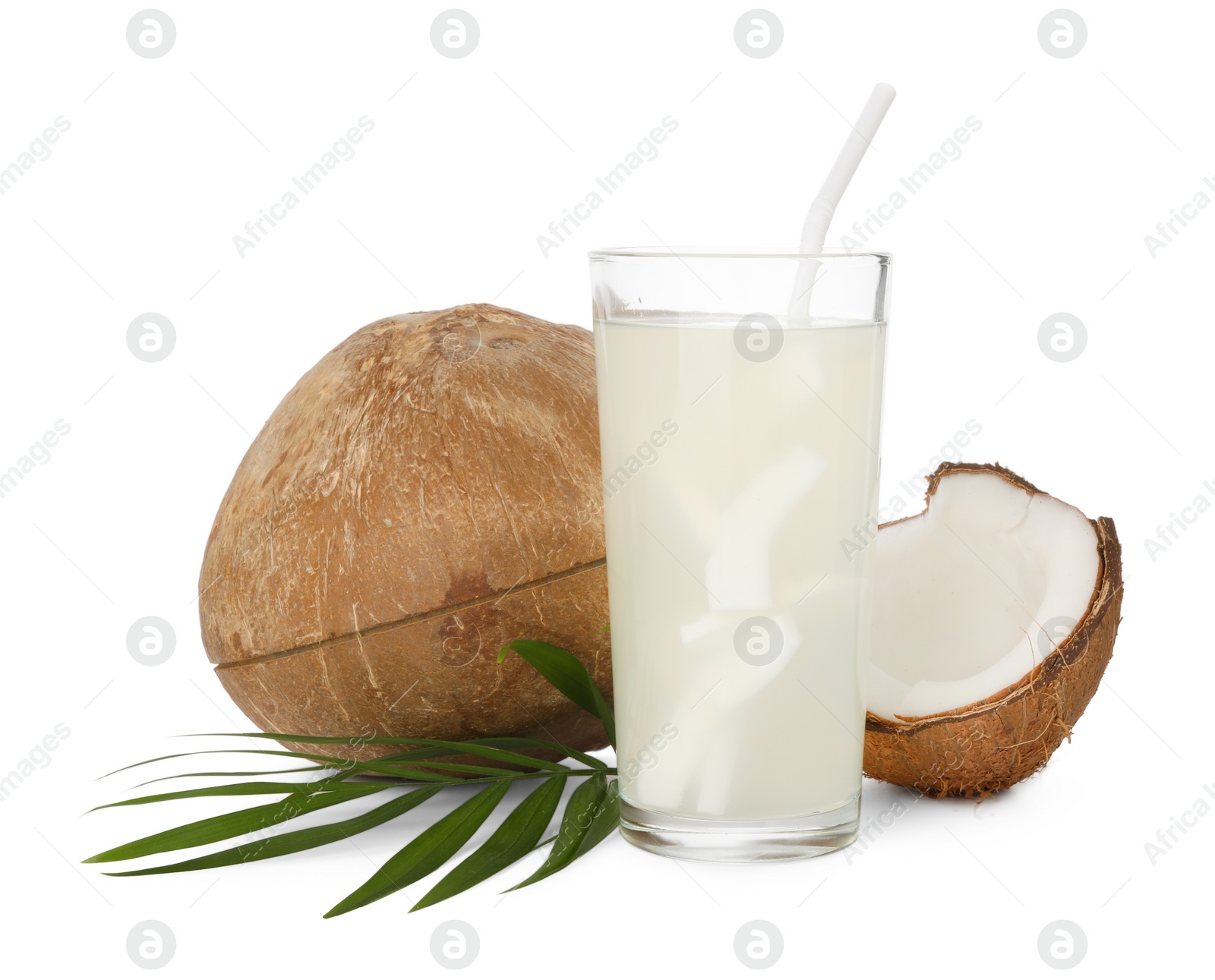 Photo of Glass of coconut water, leaf and nuts isolated on white