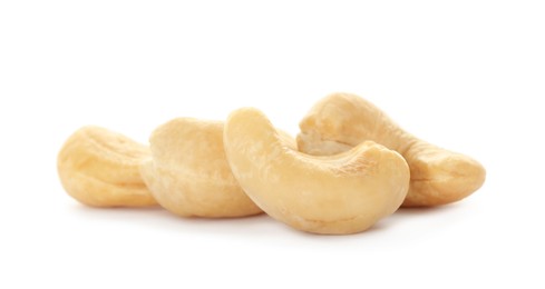 Photo of Pile of tasty organic cashew nuts isolated on white