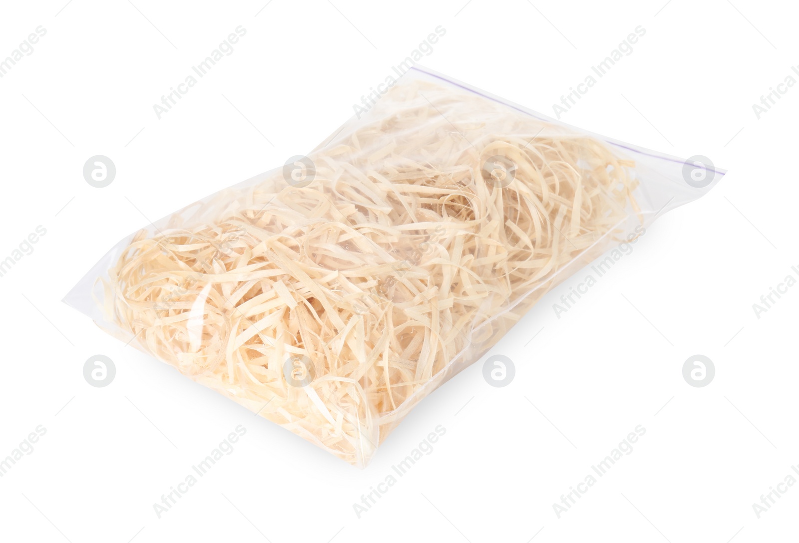 Photo of Wood shavings in zip bag isolated on white