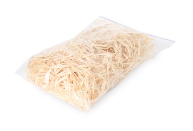 Photo of Wood shavings in zip bag isolated on white