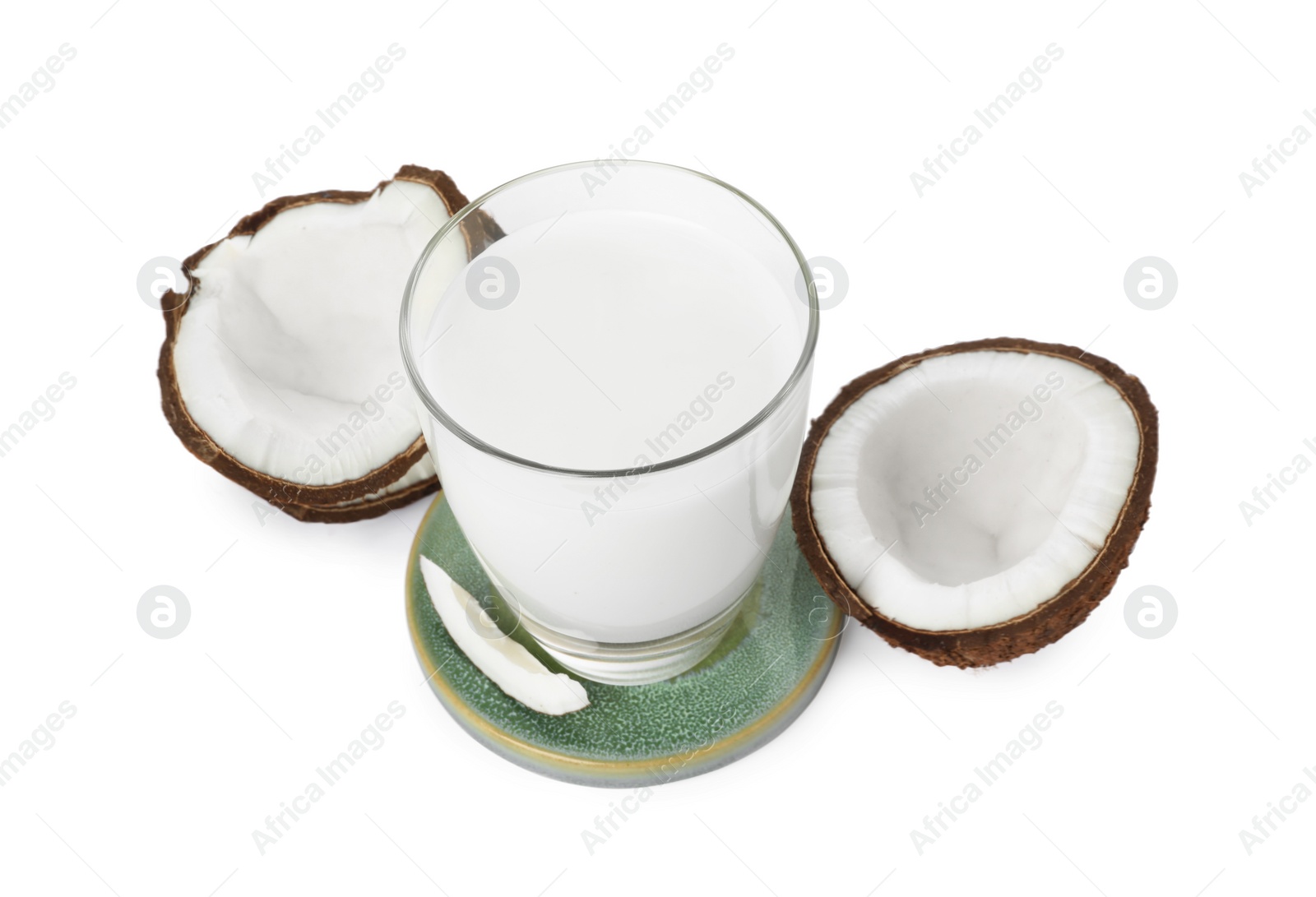 Photo of Glass of delicious coconut milk and coconuts isolated on white