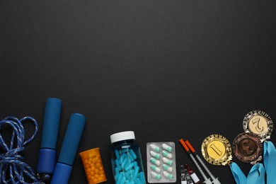 Flat lay composition with drugs on black background, space for text. Doping control