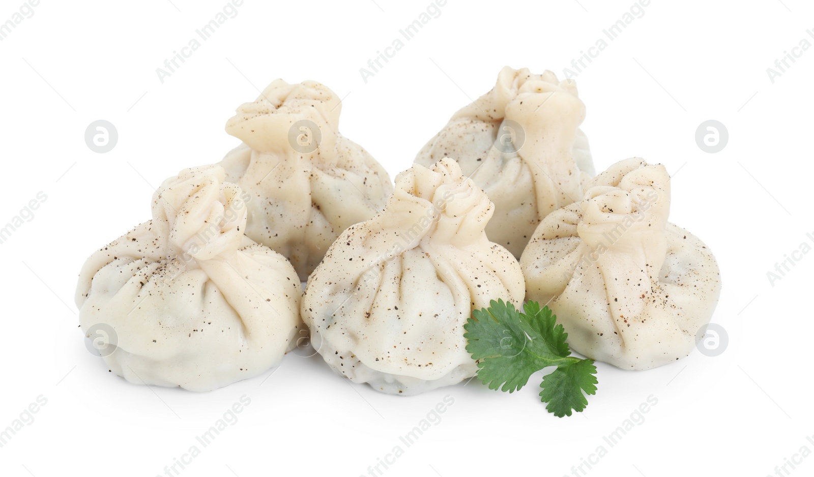 Photo of Tasty khinkali (dumplings) and spices isolated on white. Georgian cuisine