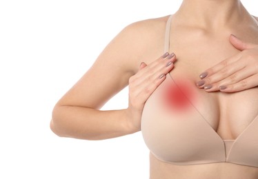 Woman checking her breast on white background, closeup