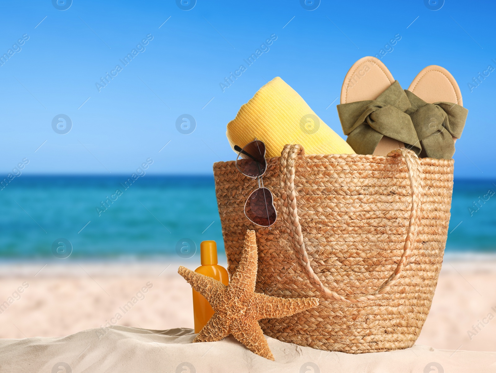 Image of Different beach objects on sandy beach near sea, space for text