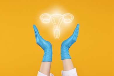 Image of Doctor and illustration of female reproductive system on orange background, closeup