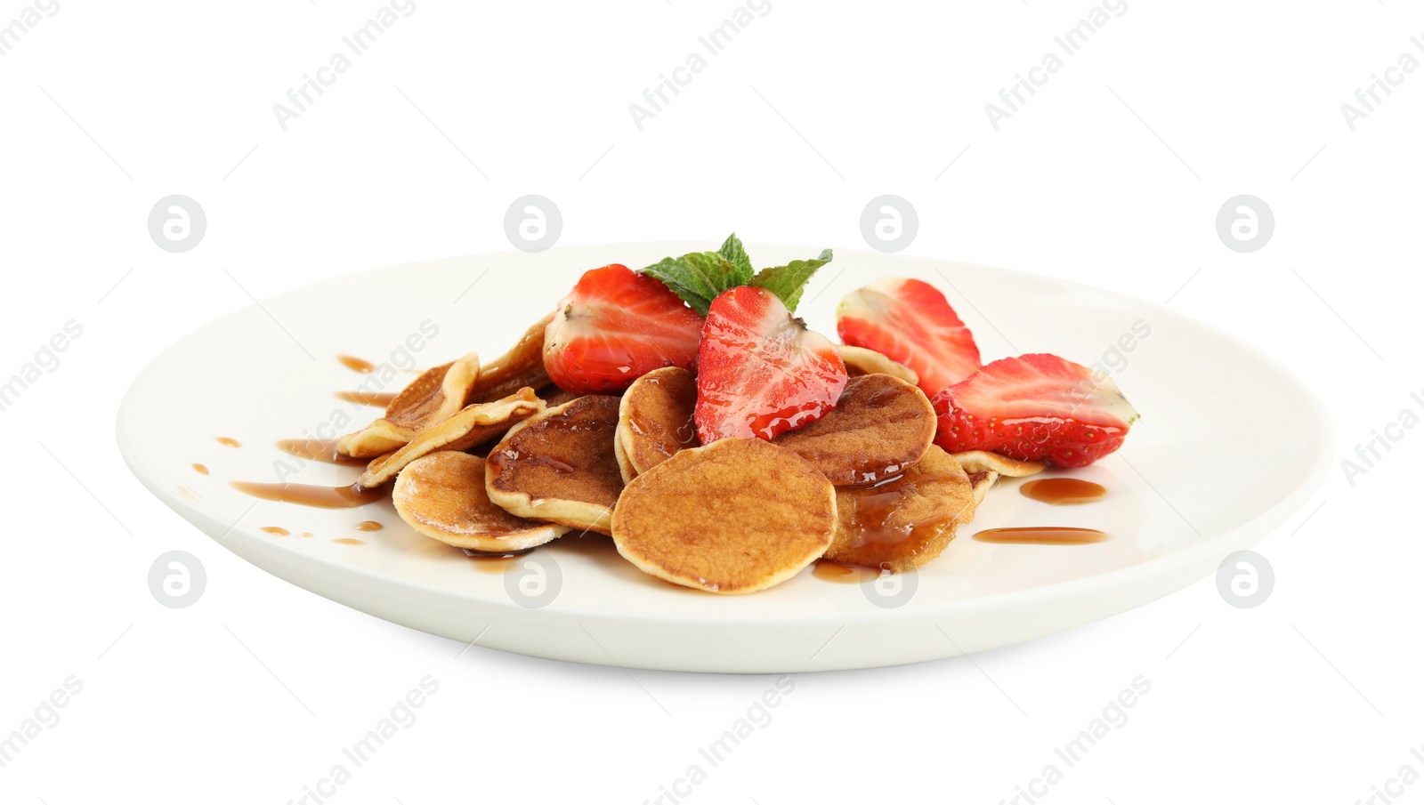 Photo of Plate with cereal pancakes and strawberries isolated on white