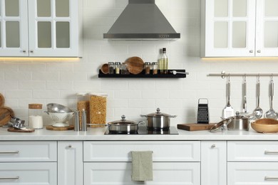 Countertop with different cooking utensils in kitchen