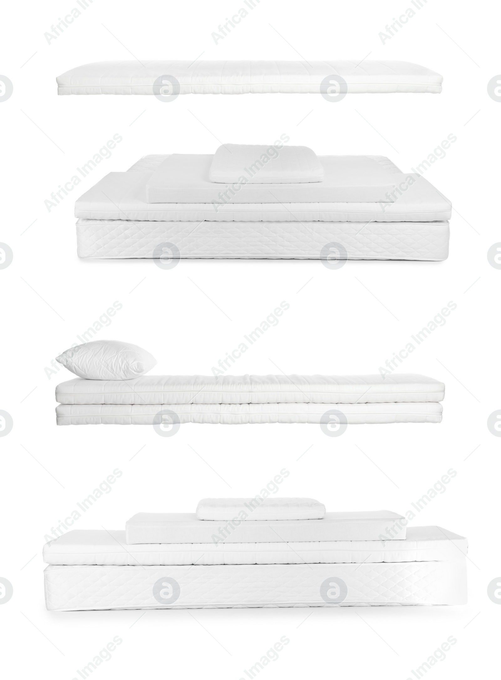 Image of Set with new comfortable mattresses on white background