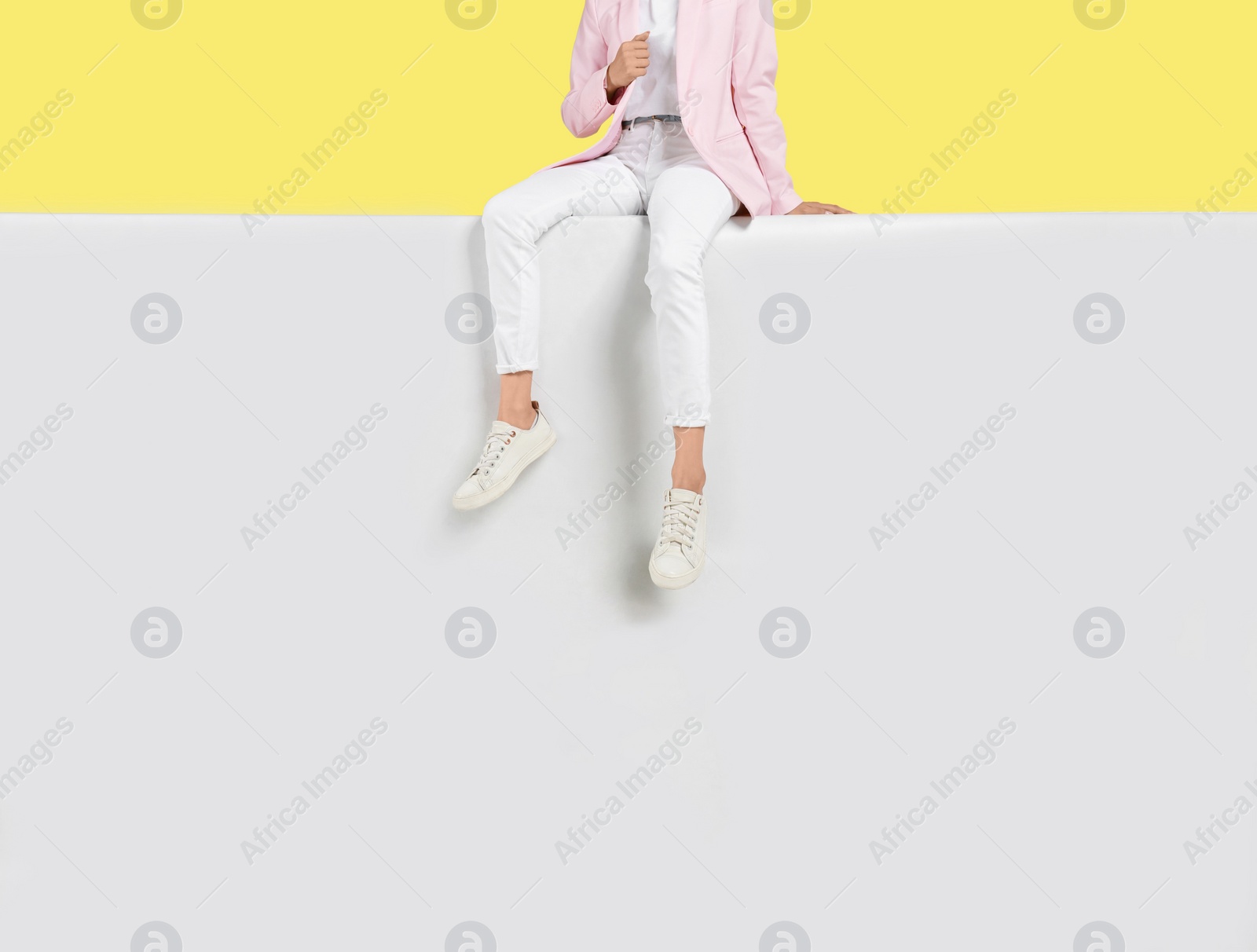 Photo of Woman wearing stylish shoes on color background, closeup