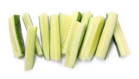 Pieces of fresh cucumber isolated on white, top view