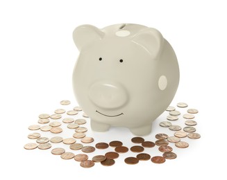 Piggy bank and coins on white background