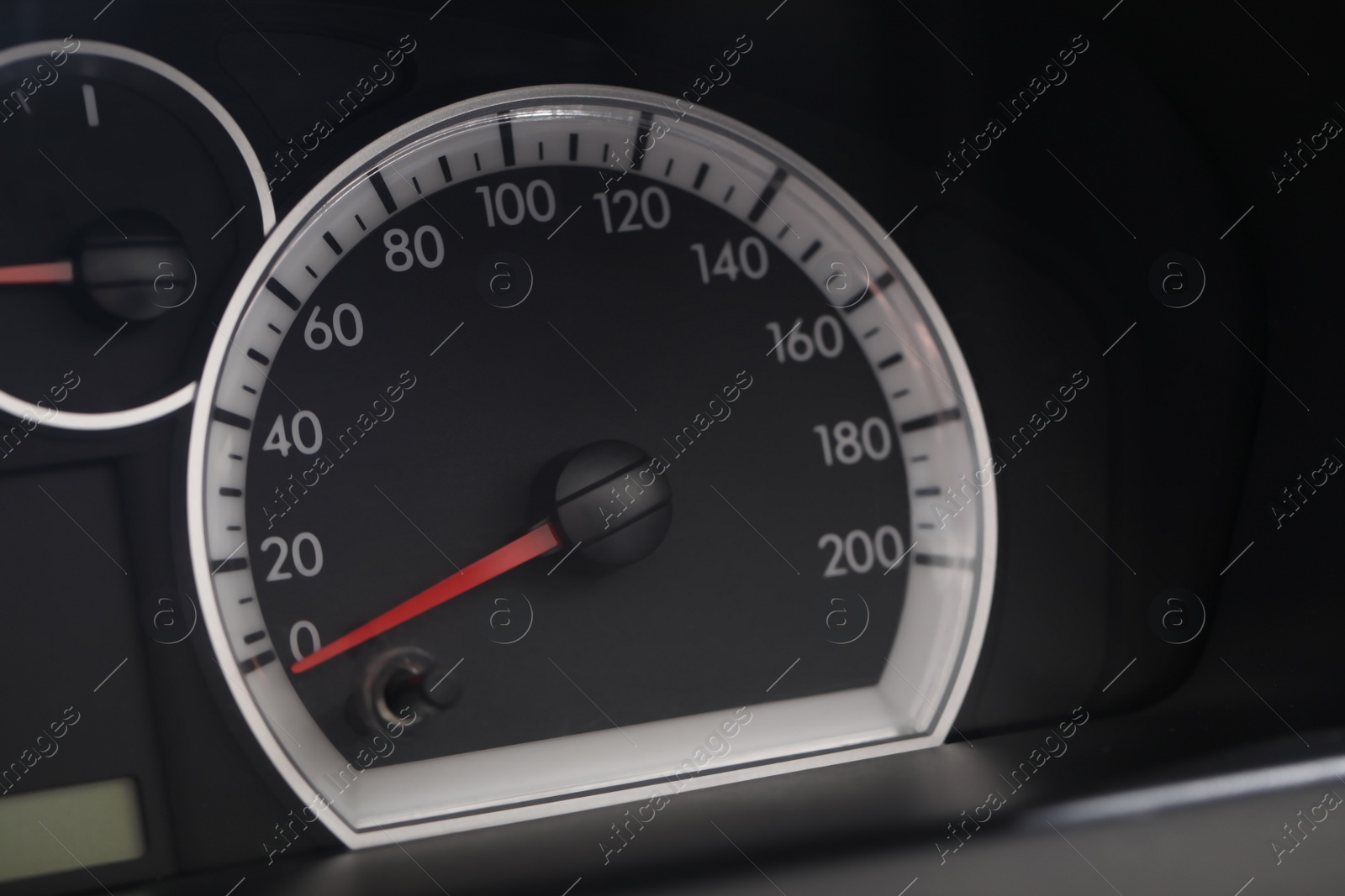 Photo of Speedometer on modern car dashboard, closeup view