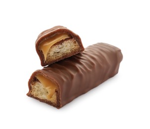 Photo of Pieces of chocolate bar with caramel on white background