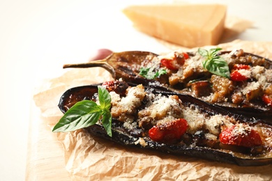 Photo of Tasty stuffed eggplants on light table