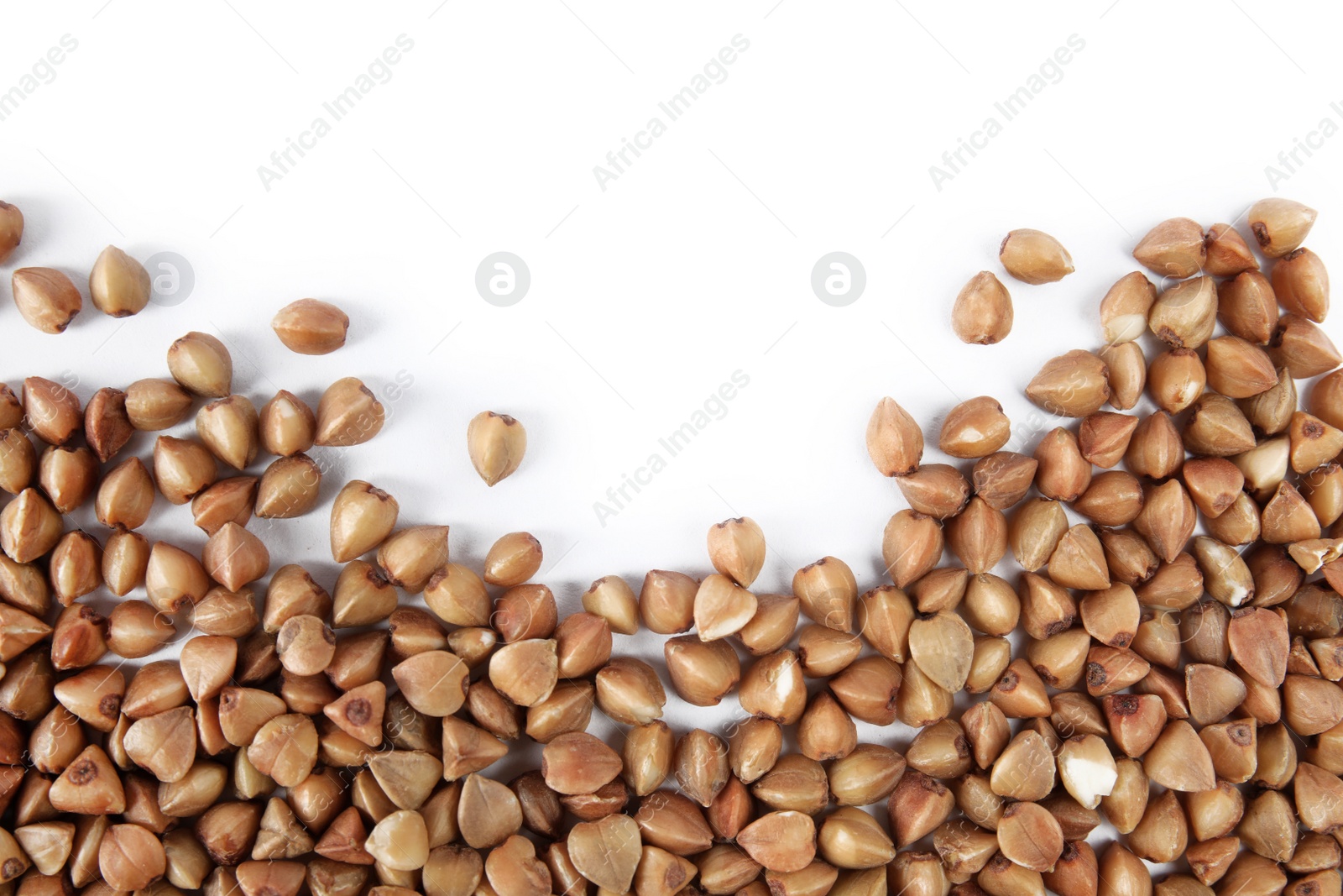 Photo of Uncooked buckwheat on white background, top view