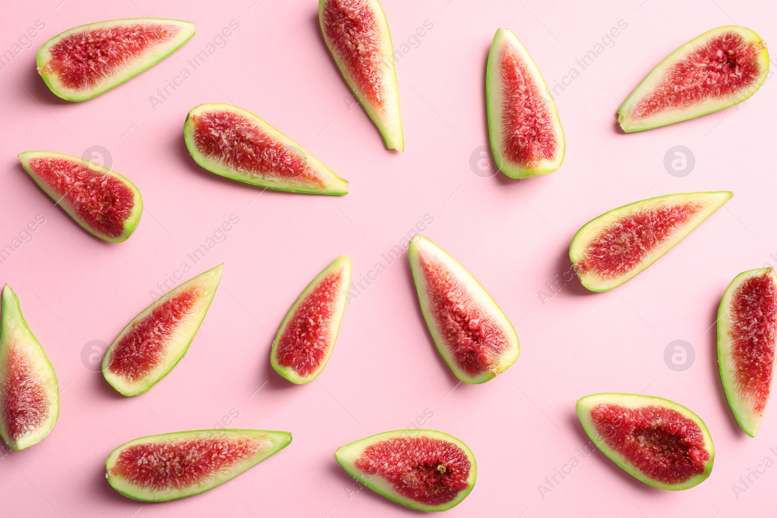 Photo of Fresh ripe fig slices on color background, top view