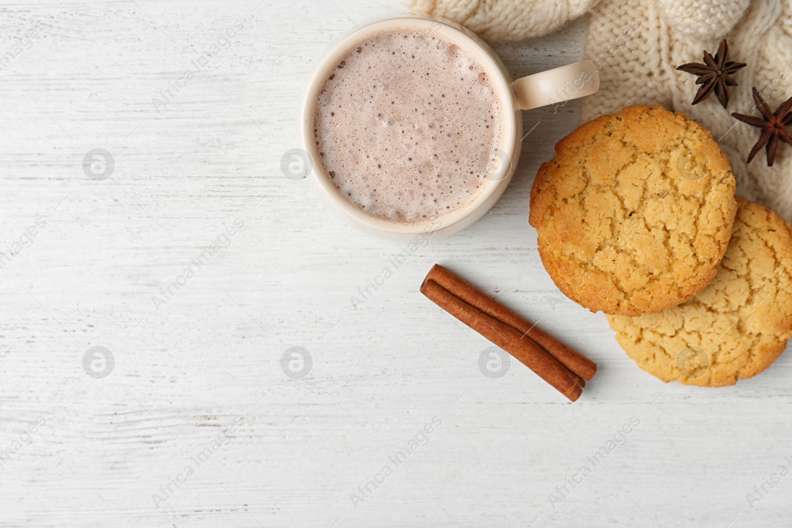 Photo of Composition with delicious hot cocoa drink and cookies on white wooden background, flat lay