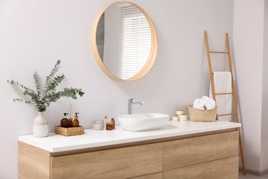 Photo of Beautiful stylish interior of bathroom with mirror and wash basin