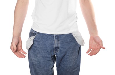 Poor man showing empty pockets on white background, closeup