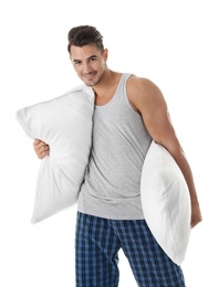 Photo of Young man with soft pillows on white background