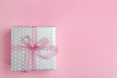 Photo of Beautifully decorated gift box on color background, top view