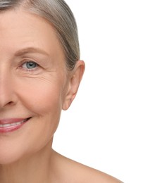Senior woman with aging skin on white background, closeup. Rejuvenation treatment