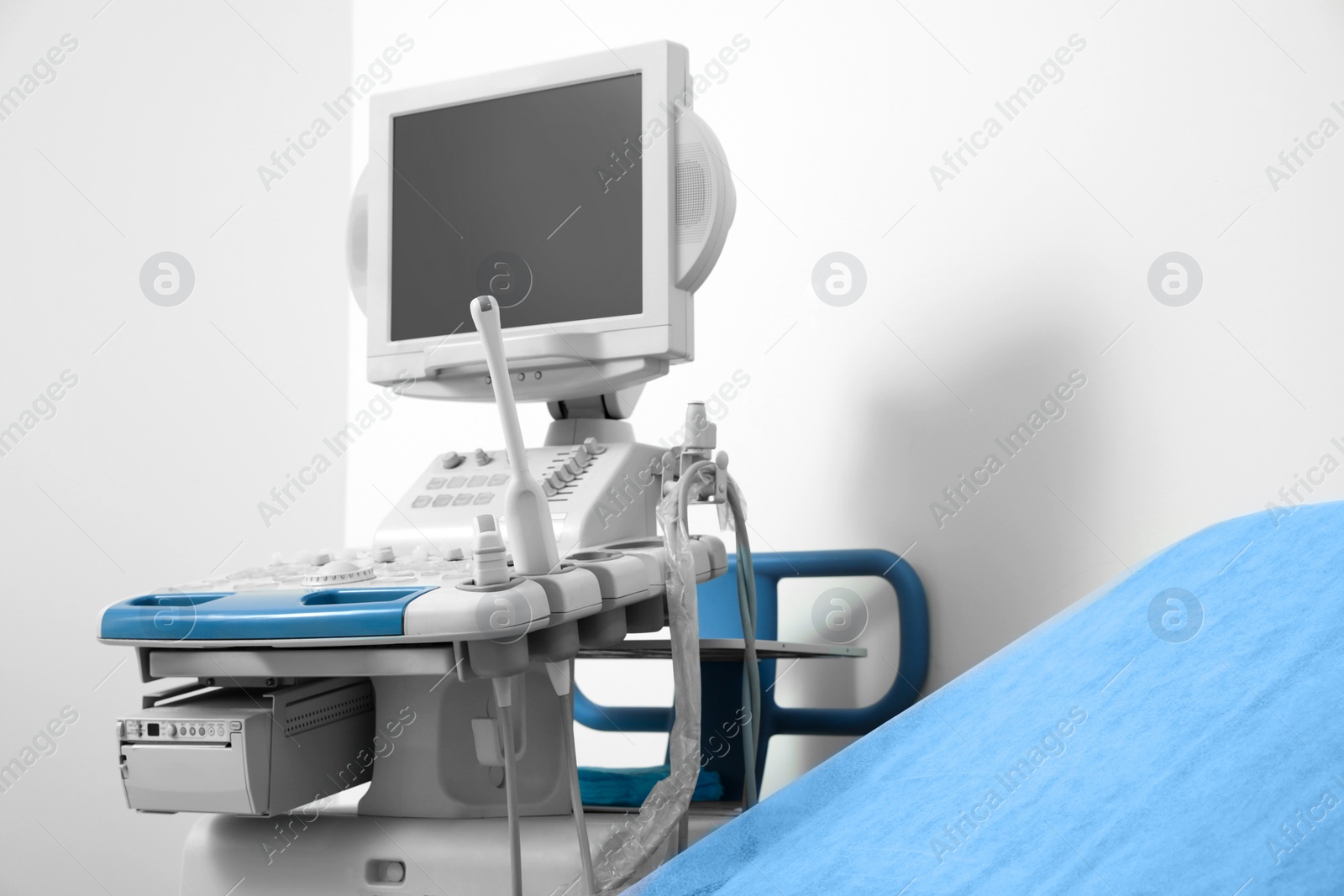 Photo of Ultrasound machine and examination table in hospital