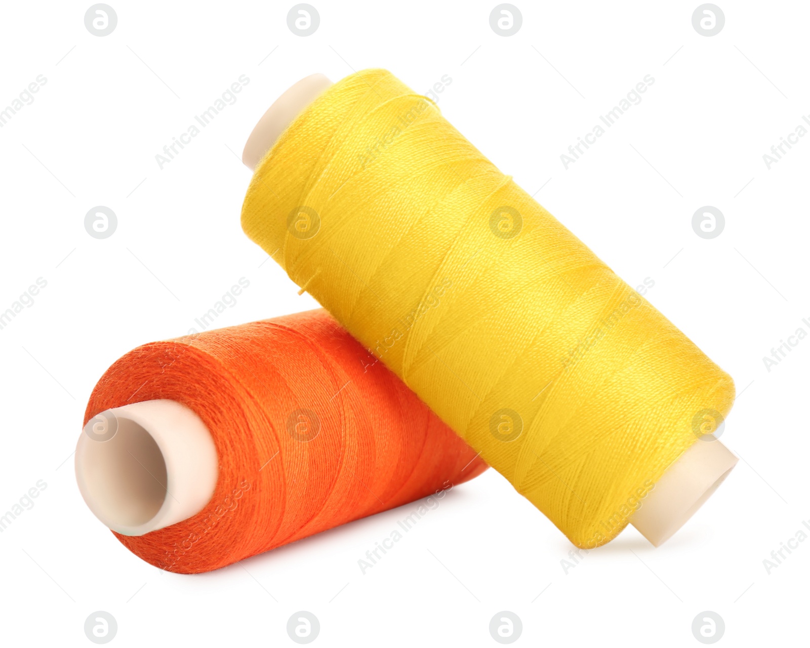 Photo of Different colorful sewing threads on white background, closeup