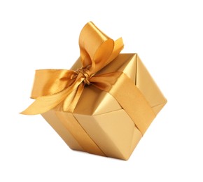 Photo of Gift box with golden ribbon and bow on white background