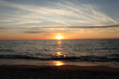 Photo of Blurred view of beautiful sea at sunset. Tropical beach