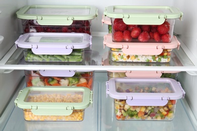 Photo of Boxes with different products inside of refrigerator