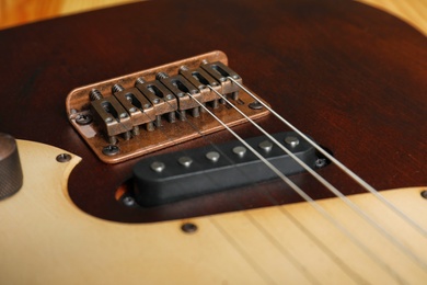 Photo of Modern electric guitar, closeup view. Musical instrument