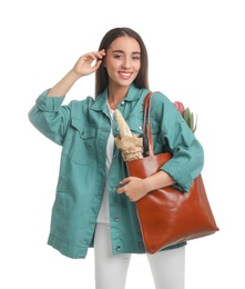 Photo of Young woman with leather shopper bag on white background