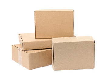 Photo of Pile of cardboard boxes on white background