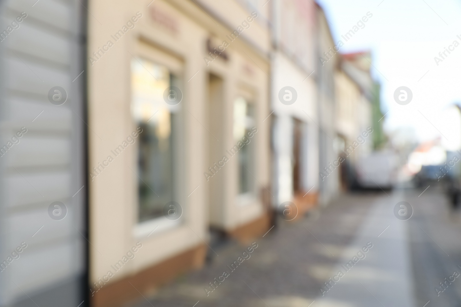 Photo of Blurred view of store exterior and city street. Bokeh effect
