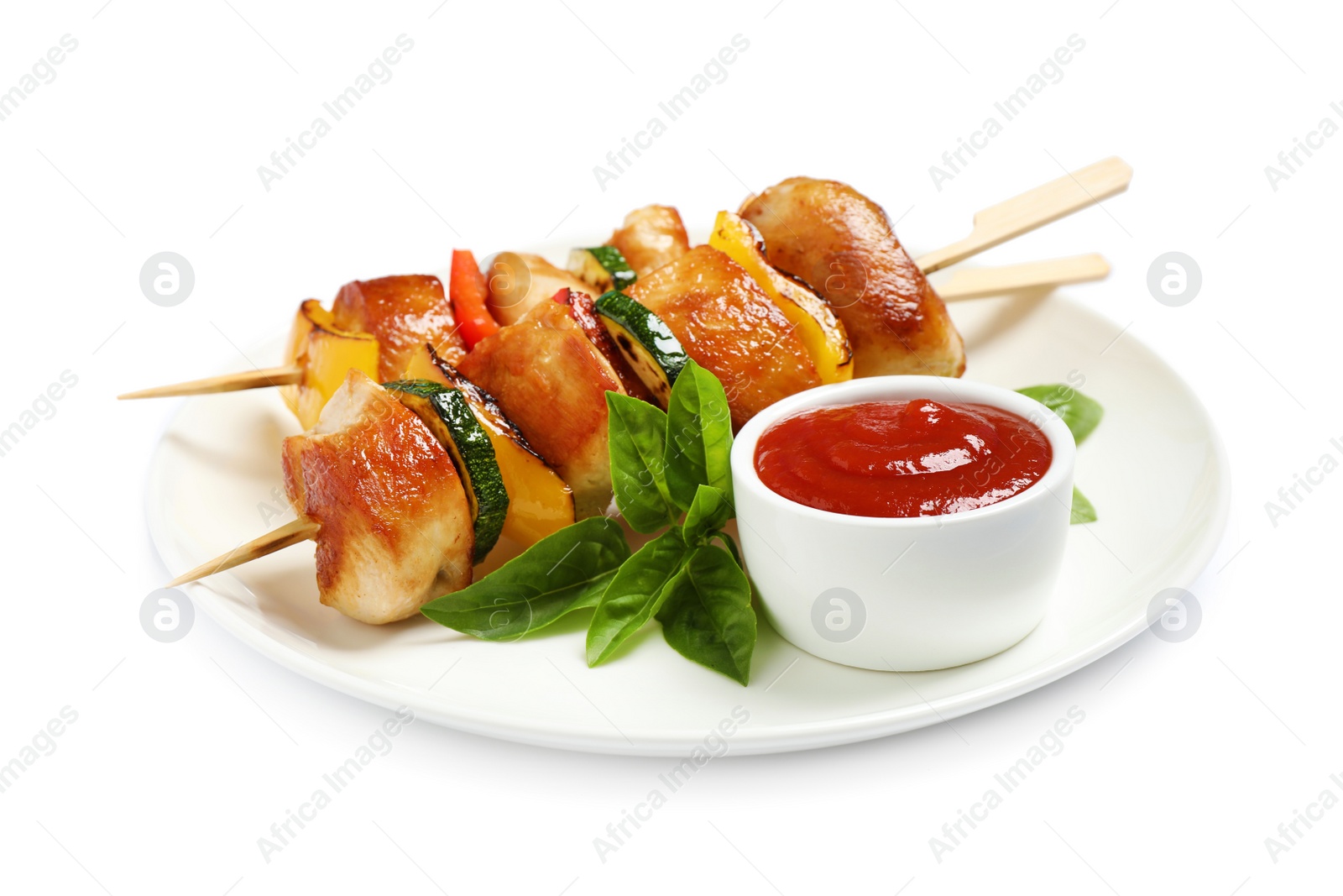 Photo of Delicious chicken shish kebabs with vegetables and ketchup on white background