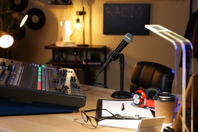 Professional audio equipment in modern radio studio