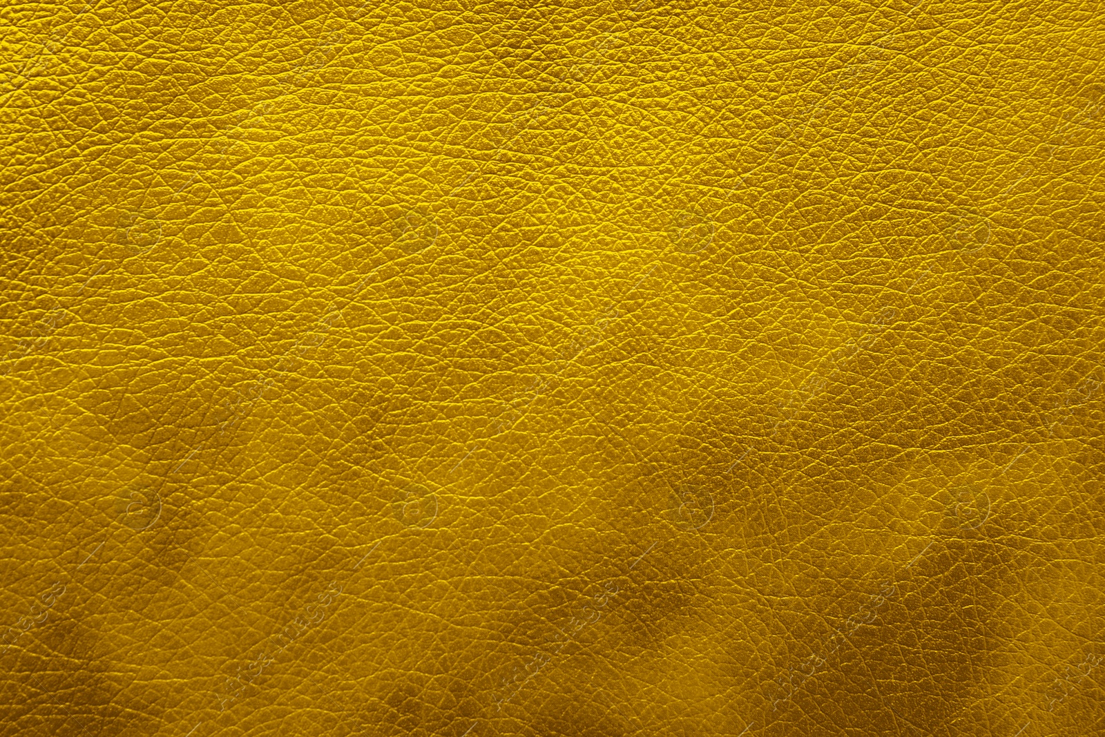 Image of Golden textured surface as background, closeup view