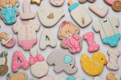 Photo of Set of baby shower cookies on light background, flat lay