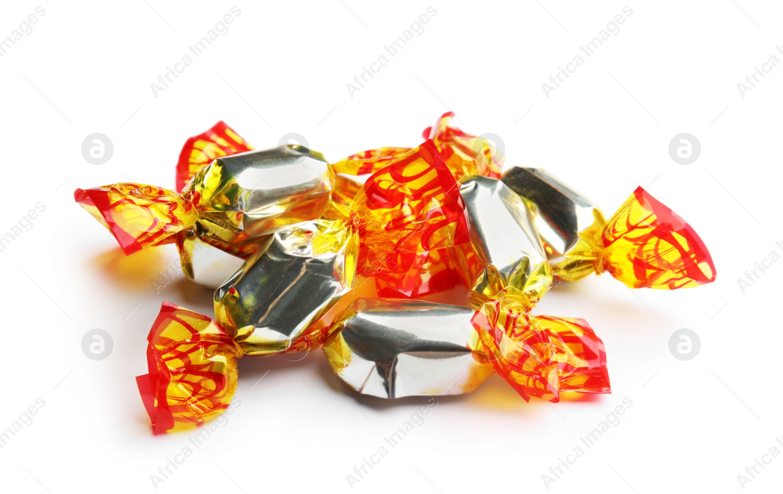 Photo of Delicious candies wrapped in foil on white background