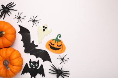 Photo of Flat lay composition with Halloween decor on white background, space for text