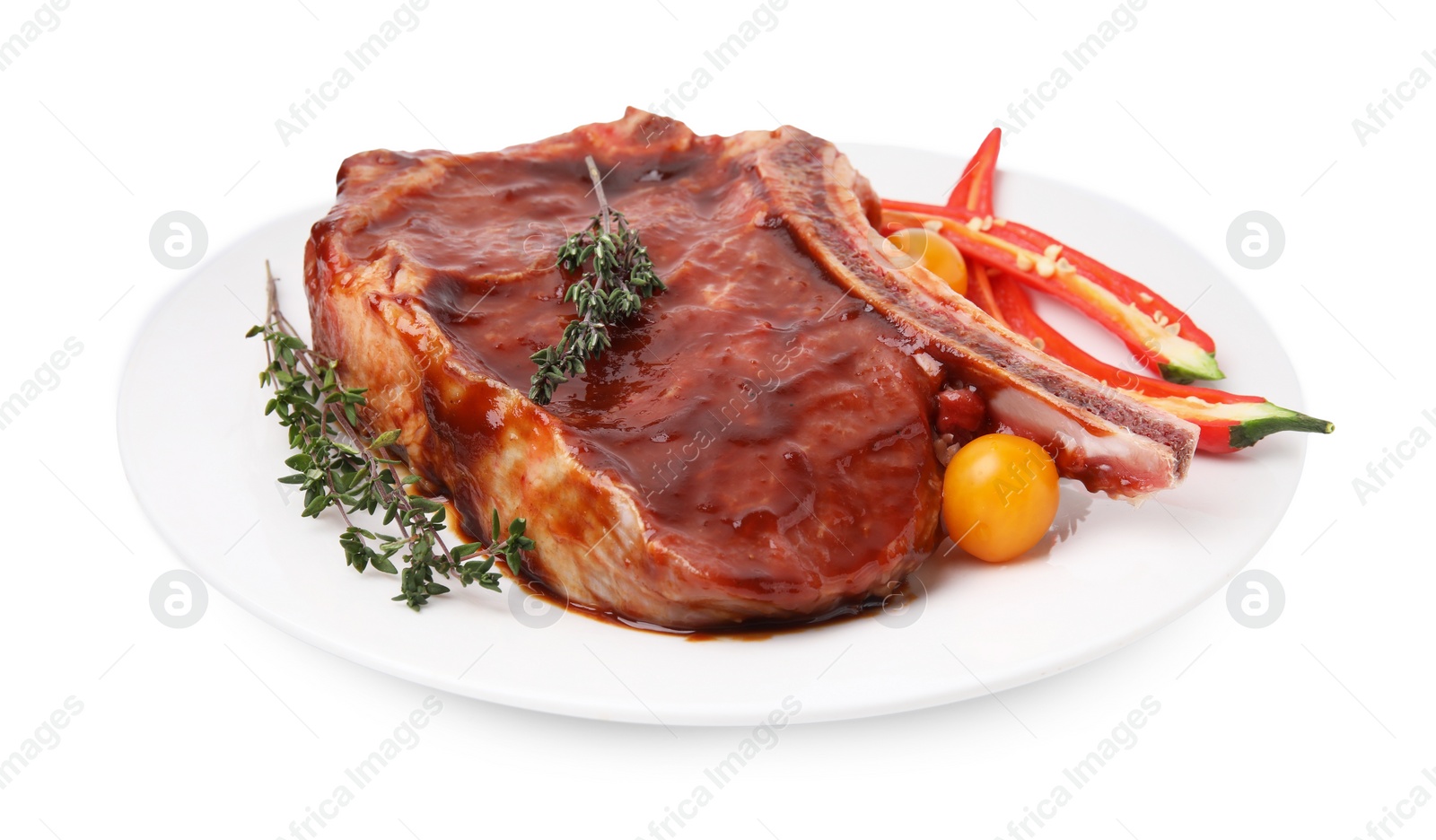 Photo of Raw marinated meat with thyme, chili pepper and tomatoes isolated on white