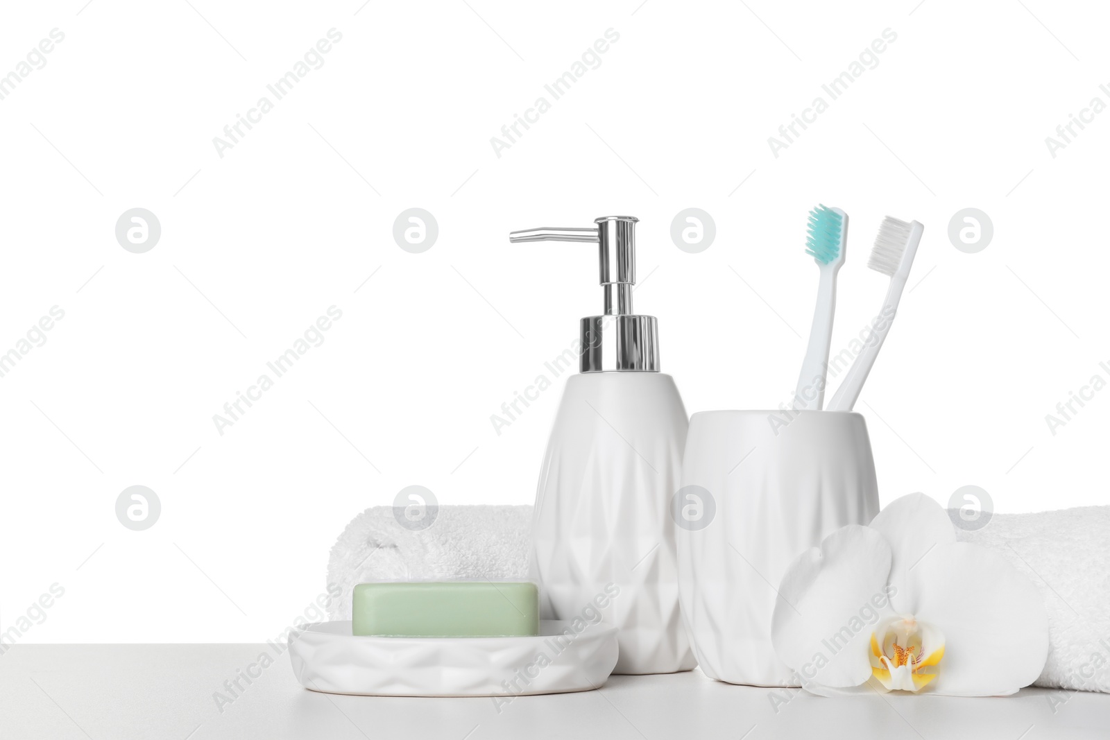 Photo of Bath accessories. Different personal care products and flower on table against white background. Space for text