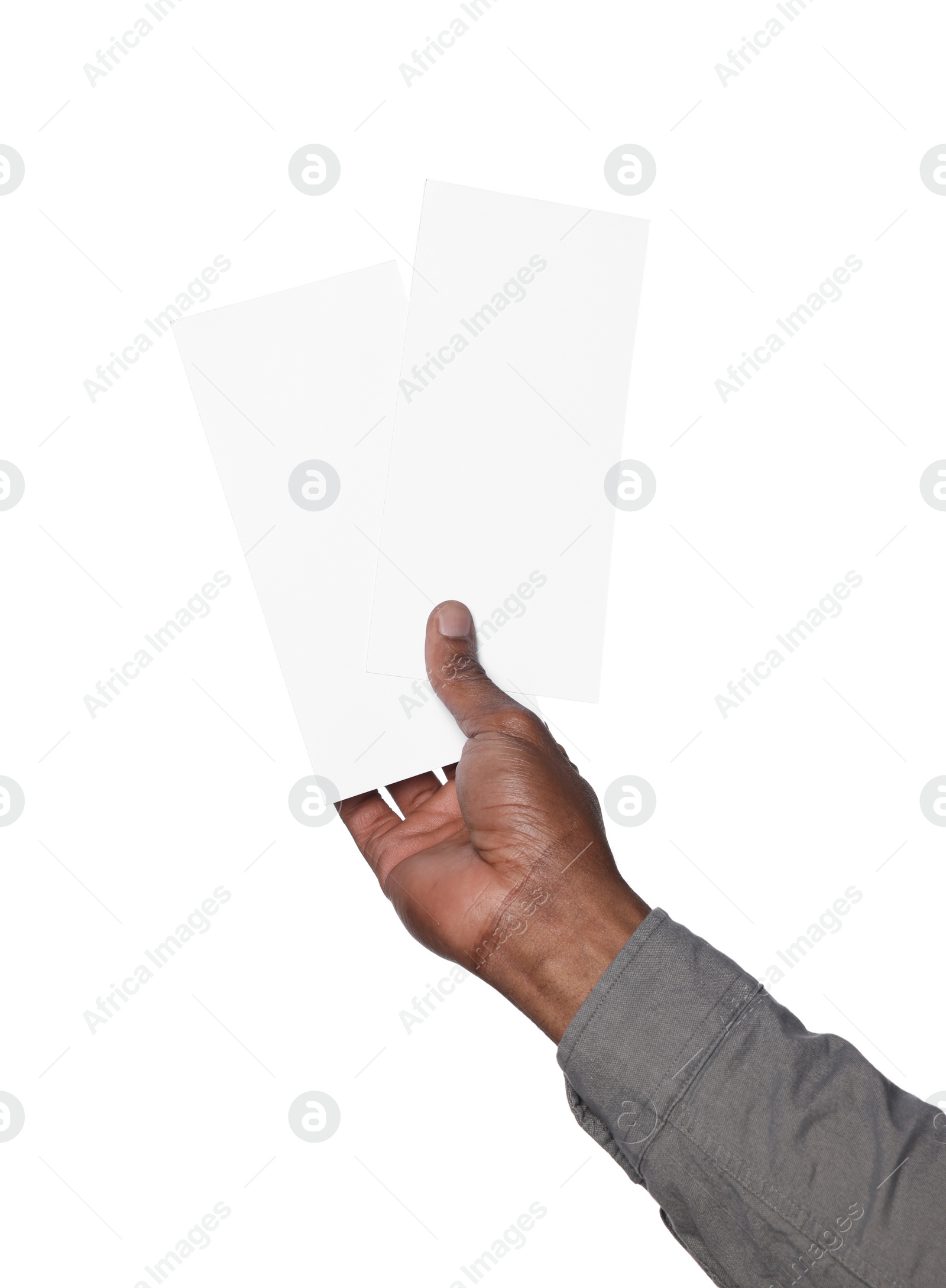 Photo of African American man holding flyers on white background, closeup. Mockup for design