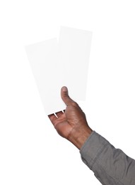 Photo of African American man holding flyers on white background, closeup. Mockup for design