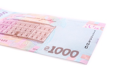 Photo of 1000 Ukrainian Hryvnia banknote on white background, closeup