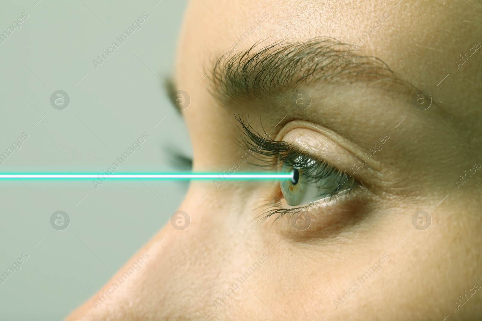 Image of Closeup view of woman and laser ray illustration. Vision correction surgery