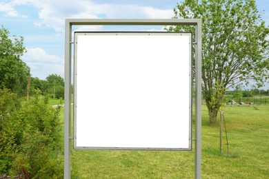 Photo of Blank advertising board outdoors on sunny day. Mockup for design